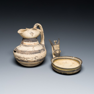 A polychrome Greek pottery 'oinochoe' ewer and a geometrically decorated Daunian pottery bowl, Southern Italy, 6th/3rd C. b.C.