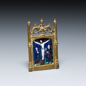 A gilt-bronze pax with a Limoges enamel 'Crucifixion' plaque, France, 1st half 16th C.