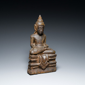 A Burmese partly gilt and lacquered teak wooden Buddha, Hanthawaddy Kingdom, 16th C.