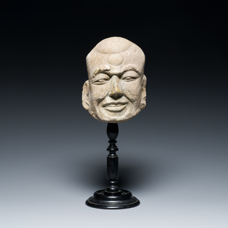 A Chinese sandstone head of a Luohan, Yuan/Ming