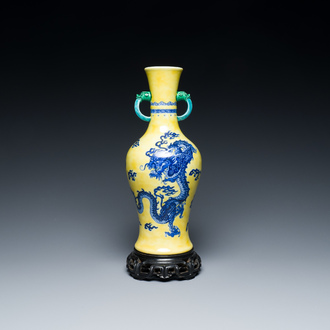 A Chinese blue and white yellow-ground 'dragon' vase with green-glazed handles on a jade-inset wooden stand, Jiaqing mark, 19/20th C.