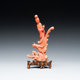 A Chinese red coral figure of a lady standing on a phoenix, 19/20th C.