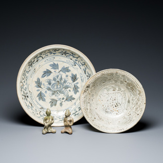 A Vietnamese or Annamese blue and white dish, a Thai Sawankhalok dish and a pair of celadon figures, 14th C. and later