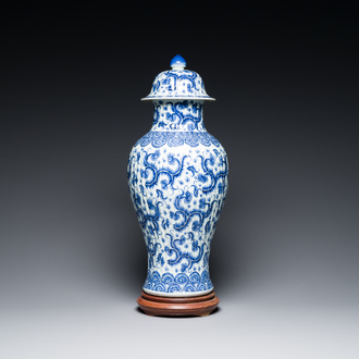 A Chinese blue and white vase and cover with floral design, Kangxi