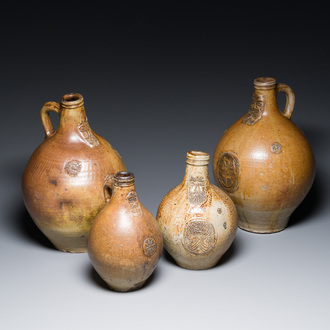 Four stoneware bellarmine jugs with various seals, Frechen and Cologne, Germany, early 17th C.