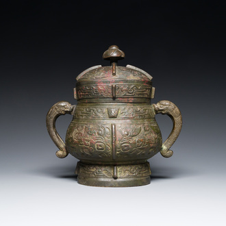 A Chinese archaic bronze ritual wine vessel and cover in Western Zhou-style, 'you', Ming