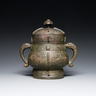 A Chinese archaic bronze ritual wine vessel and cover in Western Zhou-style, 'you', Ming