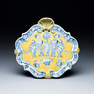 A rare Dutch Delft yellow ground 'sample' plaque, 18th C.