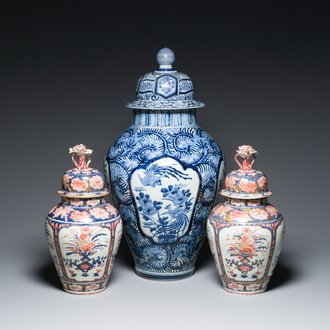 A pair of Japanese Imari vases with flower-topped covers and a large blue and white Arita vase, Edo, 17/18th C.