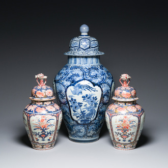 A pair of Japanese Imari vases with flower-topped covers and a large blue and white Arita vase, Edo, 17/18th C.