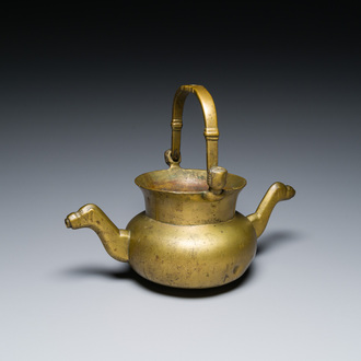 A bronze 'lavabo' water bowl with women's heads on the handles, Flanders, 1st half 15th C.
