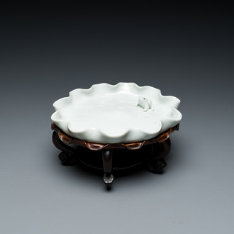 A Chinese Dehua blanc de Chine 'frog on lotus flower' brush washer on a wooden stand, Kangxi/Yongzheng