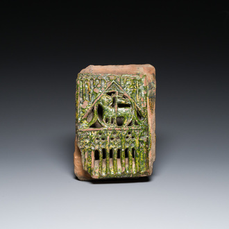 A green-glazed reticulated 'Agnus Dei' stove tile, Germany, 15th C.