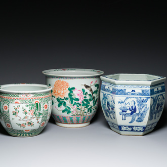 Three Chinese blue and white, famille rose and famille verte fish bowls and jardinières, 19th C.