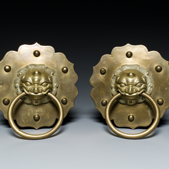 A pair of Chinese brass door knockers with lion heads, 19th C.