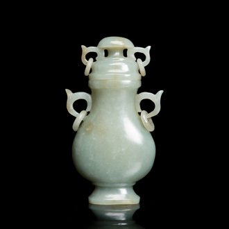 A Chinese celadon jade vase and cover, 19/20th C.