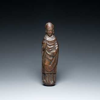 A carved oak figure of a blessing saint or bishop, England or France, 15th C.