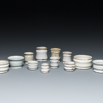 Twelve white Delftware ointment jars and miniature albarelli, 17th C.