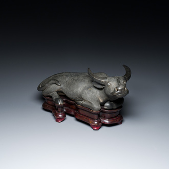 A large Chinese grisaille sculpture of a buffalo on wooden stand, 18/19th C