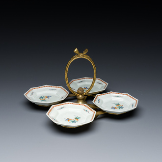 Four Japanese Kakiemon-style octagonal dishes in a brass mount, Edo, 18th C.