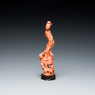 A Chinese red coral figure of a lady standing on a phoenix, 19/20th C.