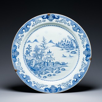 A large Chinese blue and white 'landscape' dish, Qianlong