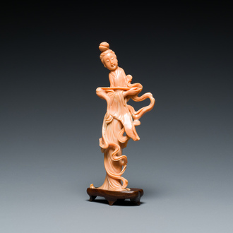 A Chinese red coral figure of a lady with a fly-whisk, 19/20th C.