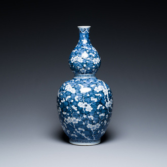 A Chinese blue and white double gourd 'prunus on cracked ice' vase, 18th C.