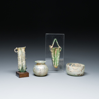 Two Roman glass balsamariums, a flask and a bowl, 2nd/4th C.