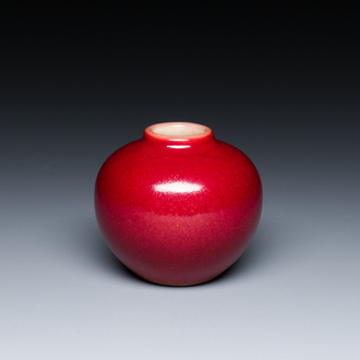 A small Chinese red-glazed globular vase, 20th C.