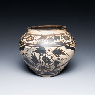 A Chinese Cizhou pottery jar with floral design, Song
