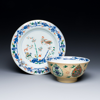 A Chinese famille verte 'phoenix and kylin' plate and a bowl for the Persian market, Kangxi
