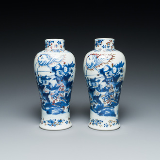 A pair of Chinese blue, white and copper-red vases, Kangxi mark, 19th C.