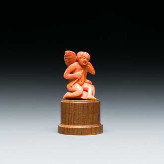 An Italian red coral carving of a winged cherub, Trapani, Sicily, 19th C.