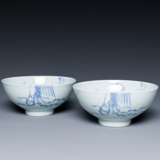 A pair of Chinese blue and white 'phoenix' bowls, Yongzheng mark and of the period