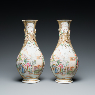 A pair of Chinese famille rose 'mandarin subject' bottle vases, Qianlong