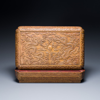 A Chinese rectangular huanghuali wooden box and cover with dragons, 17/18th C.