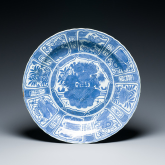 A very large Chinese blue and white kraak porcelain dish with a flower basket, Wanli