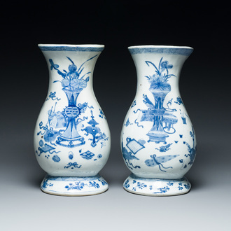 A pair of Chinese blue and white wall pocket vases with antiquities, Kangxi