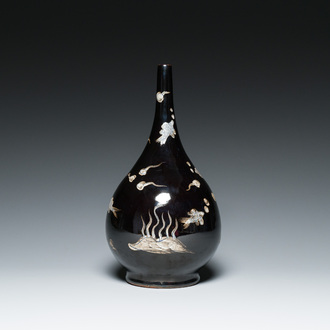A Chinese black-glazed reverse-decorated bottle vase, 19th C.