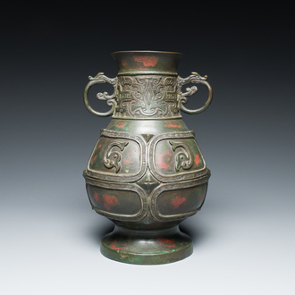 A Chinese gold and silver-inlaid bronze vase with pseudo-rust patina, 18th C.