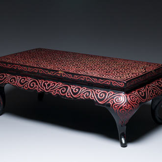 A Chinese rectangular carved red and black lacquer table, 'kang', Xuande mark, 20th C.