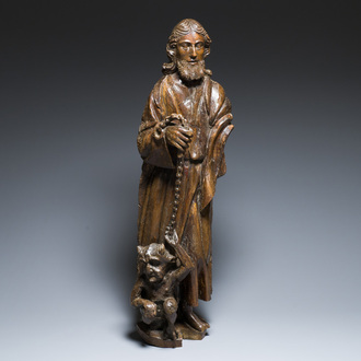 A carved oak figure of Lazarus as a blindman lead by the devil at his feet, France, 16th C.