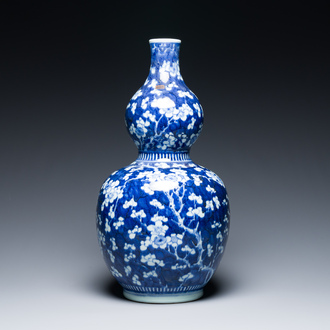 A Chinese blue and white double gourd 'prunus on cracked ice' vase, 18th C.