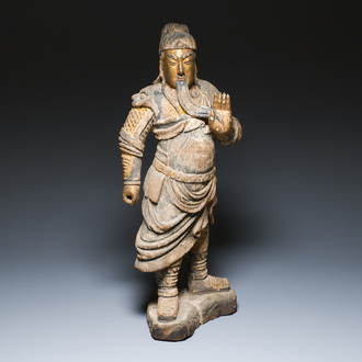 A large Chinese partly gilded and polychromed wood sculpture of Guandi, 17th C.