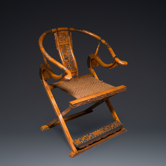 A Chinese horseshoe back folding chair with metal fittings, 19/20th C.