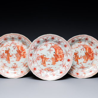 Three Chinese iron-red and gilt lotus-shaped plates, Kangxi