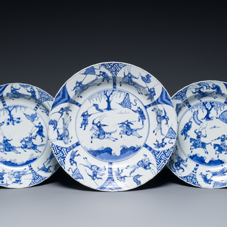 Three large deep Chinese blue and white 'hunting scene' dishes, Chenghua mark, Kangxi