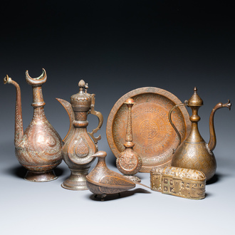 A varied collection of Islamic copper and tin utensils, 19/20th C.