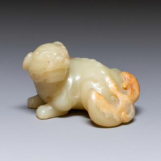 A Chinese white and russet jade sculpture of a mythical beast, 18th C.